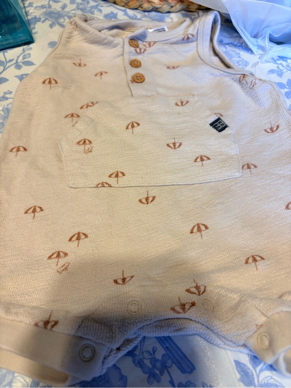 Soft Cream Baby Romper with Rust Umbrella Print
